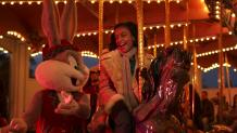Guest and Bugs Bunny riding the Carousel at Six Flags New England