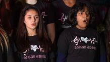 Young choir students singing outside