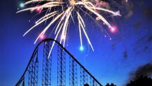Fireworks go off behind Superman: Ride of Steel