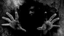 person in the shadows
