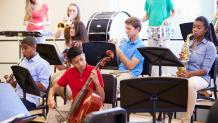 students playing various instruments