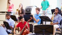 students playing various instruments