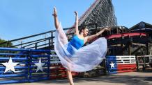 dancer posing in front of Texas Giant
