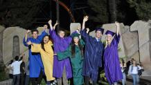 Grads celebrating in front of Goliath