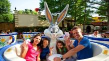family and Bugs Bunny on tea cups ride