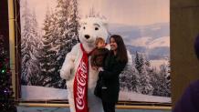 Mother and son with coca-cola bear