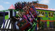 Guests enjoy coasters during DC Super Friends Opening