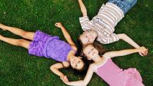 Girls holding hands at Girl Scout Day & Camporee at Six Flags The Great Escape.