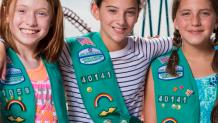 Group of girl scouts in front of a coaster
