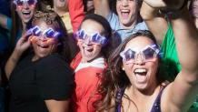 teens wearing sunglasses and looking happy