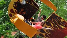 Guests riding Screamin Eagles at Six Flags Great Escape