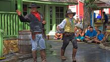 The Marshall and his Assistant stand off with the bad guys in the Texas Justice show