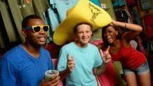 Park guests having fun with an oversized hat