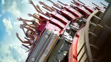 passengers with hands up on a roller coaster Texas Giant