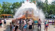 Group getting wet at the interactive water playground