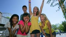 Excited Teens at Theme Park