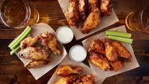 Wings and beer on table