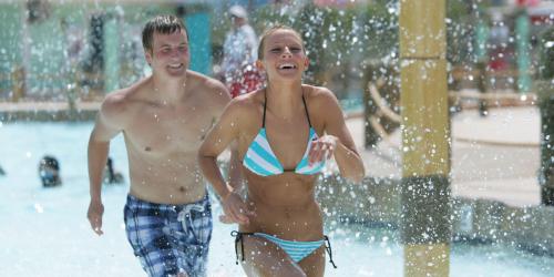 teens running through wave pool