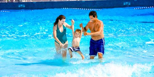 Family playing in water