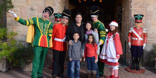 Family with characters at Holiday in the Park