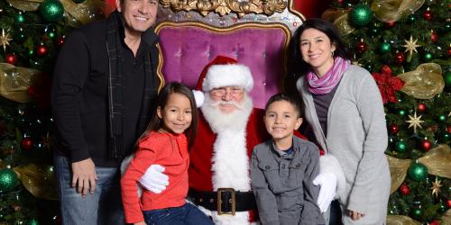 Family posing with Santa