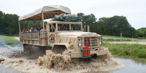 Safari truck driving through water