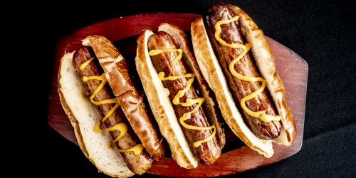 Grilled Brats on a Pretzel Roll with Mustard