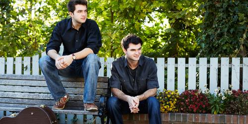 The Como Brothers on a bench