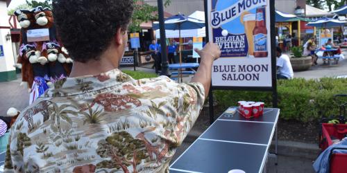 Guest playing Pong Toss during Food and Brew Festival at Six Flags New England