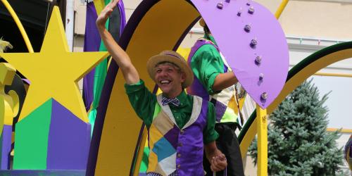 Entertainment performer on a Mardi Gras Festival parade float