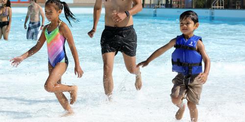 kids running in wading pool