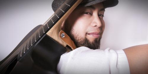 Kyle Tacy with Guitar on his back