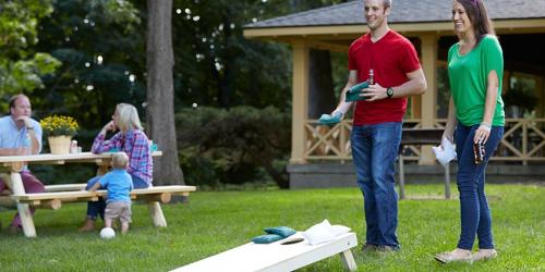 Friends playing cornhole