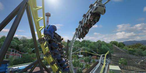 Coaster trains racing out of a launch and intertwining.