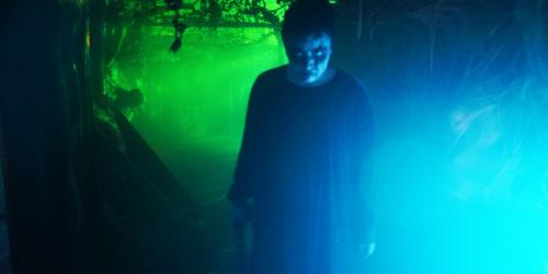 Spooky woman in the Wicked Woods during Fright Fest at Six Flags New England