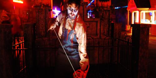 Bloody man with chainsaw in Main Street Graveyard during Fright Fest at Six Flags New England