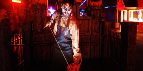 Man With Chainsaw In Main Street Graveyard During Fright Fest At Six Flags New England Man With Chainsaw In Main Street Graveyard During Fright Fest At Six Flags New England