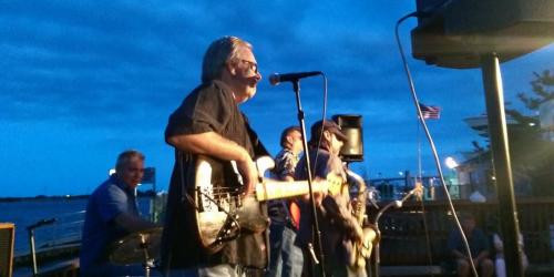 Sonny Kenn band playing guitar
