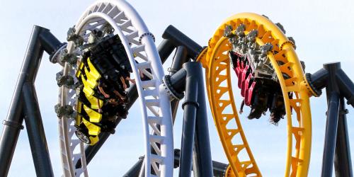 Racing coaster, with two trains overbanking around a curve