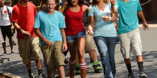 Excited family walks through Six Flags