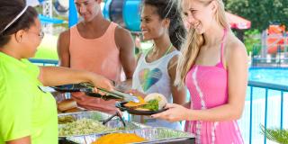 People eating at Hurricane Harbor Concord