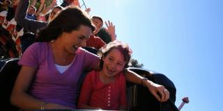 Family Rides Mother and daughter on a roller coaster