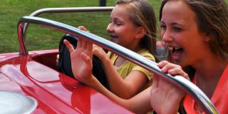 Kids having fun driving a car.