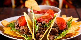 Tacos and chips on a plate