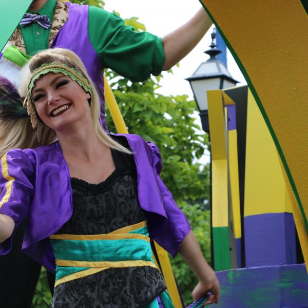 Entertainment Performers in front of Parade Float for Mardi Gras Festival