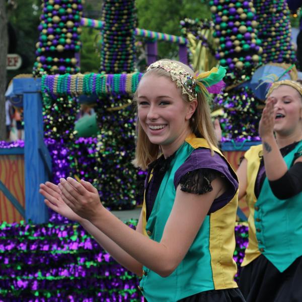 Entertainment Performers in front of Parade Float for Mardi Gras Festival