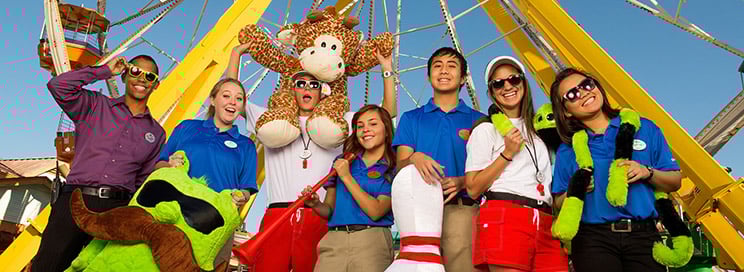 Employees at Six Flags in front of a ride