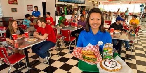 Employees serving food at a restaurant