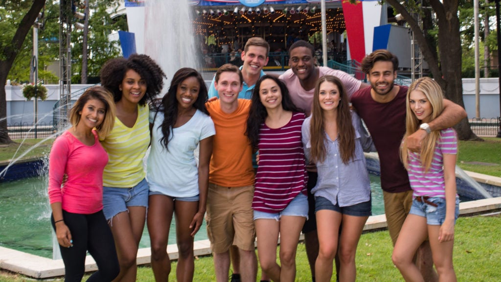 Youth group in front of carousel